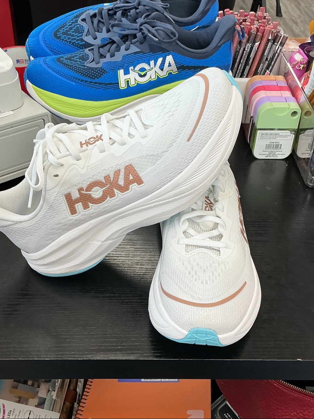 Hoka Women's White Running Shoes with Rose Gold Logo and Aqua Outsole